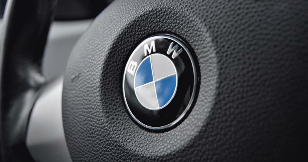 picturing showing the bmw logo design on the car's steering wheel