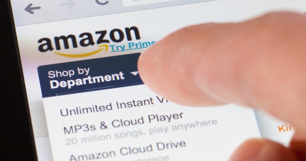 zoom-in photo of hand or finger touching the amazon prime site on screen