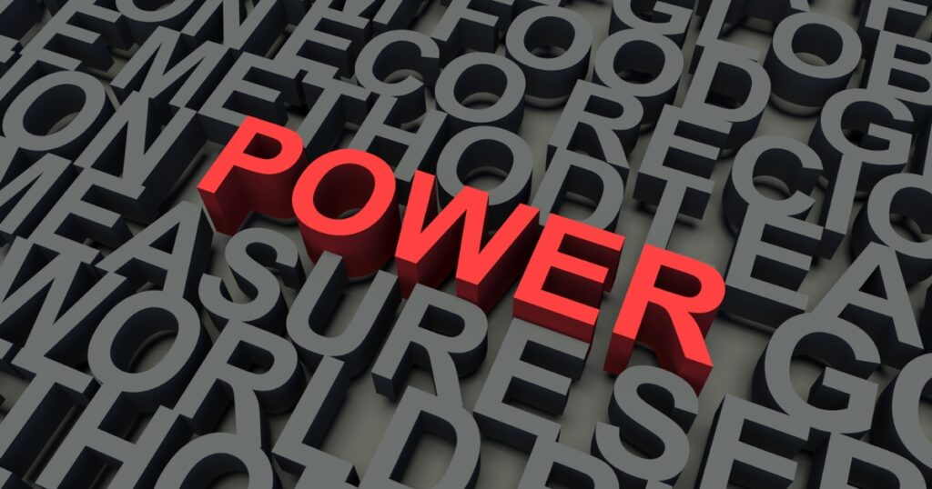 the word power in color red among other lettering in black background