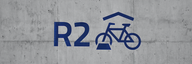 wordmark logo with a bicycle in blue
