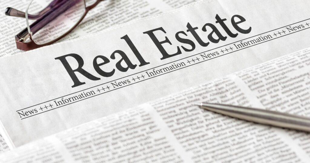 the word real estate printed in a newspaper